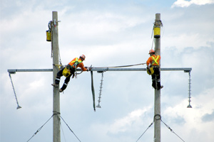 Above, Hydro One Workers on Poles