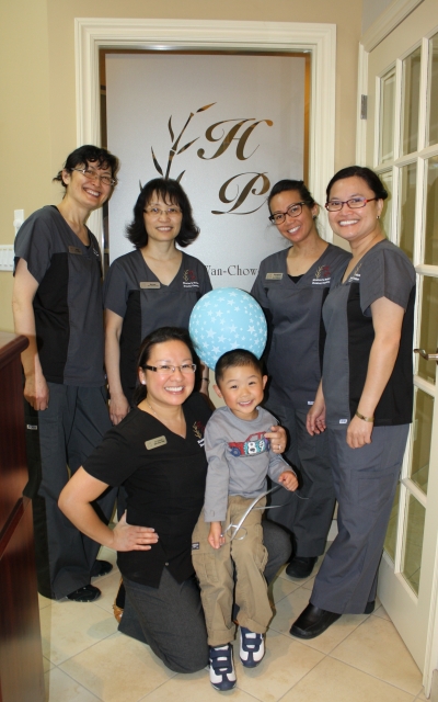 Hunter's Point Dental Centre: Left to right, front row: Dr. Patricia Wan-Chow-Wah and a very happy kid; back row: Meiqi, Norma, Florence and Wilma.